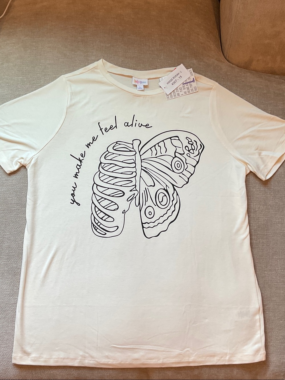 Cream Graphic Tee with Butterfly Ribcage Design You Make Me Feel Alive